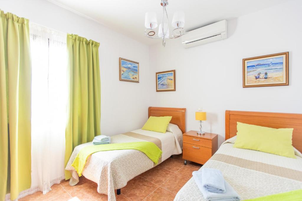 A bed or beds in a room at Villa Bella Lucia Luxury 2
