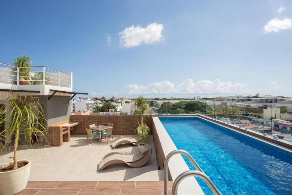 a balcony with a swimming pool on top of a building at Precious Studio w/ working station in Playa del Carmen