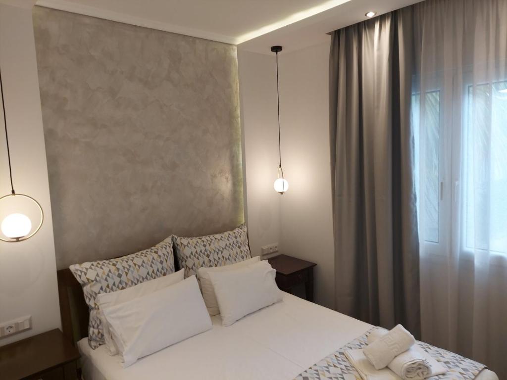 Posteľ alebo postele v izbe v ubytovaní SUN RESIDENCE Exclusive Seaside Suites