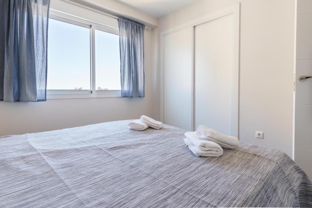 Posteľ alebo postele v izbe v ubytovaní Apartment Acapulco 6