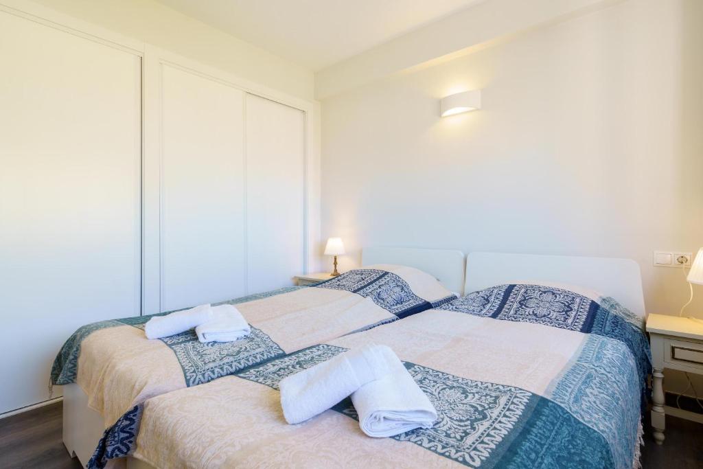 Posteľ alebo postele v izbe v ubytovaní Apartment Acapulco 6