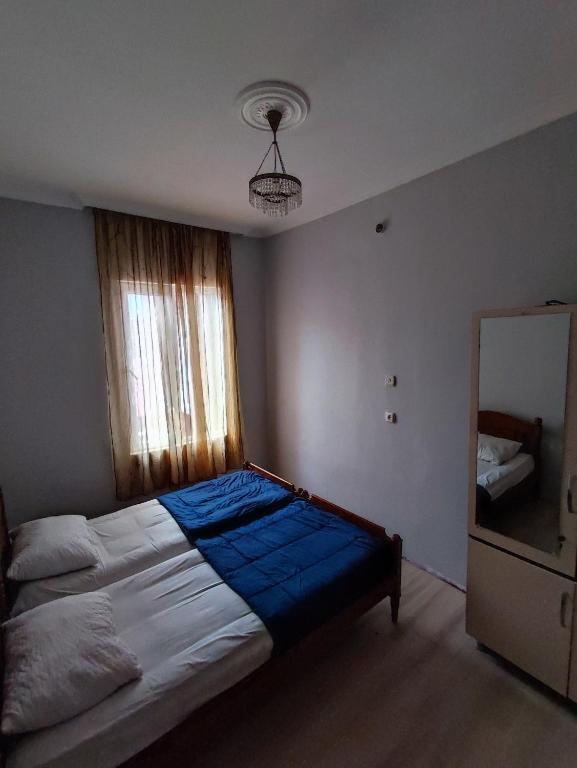 Postel nebo postele na pokoji v ubytování Kobuleti Guest House