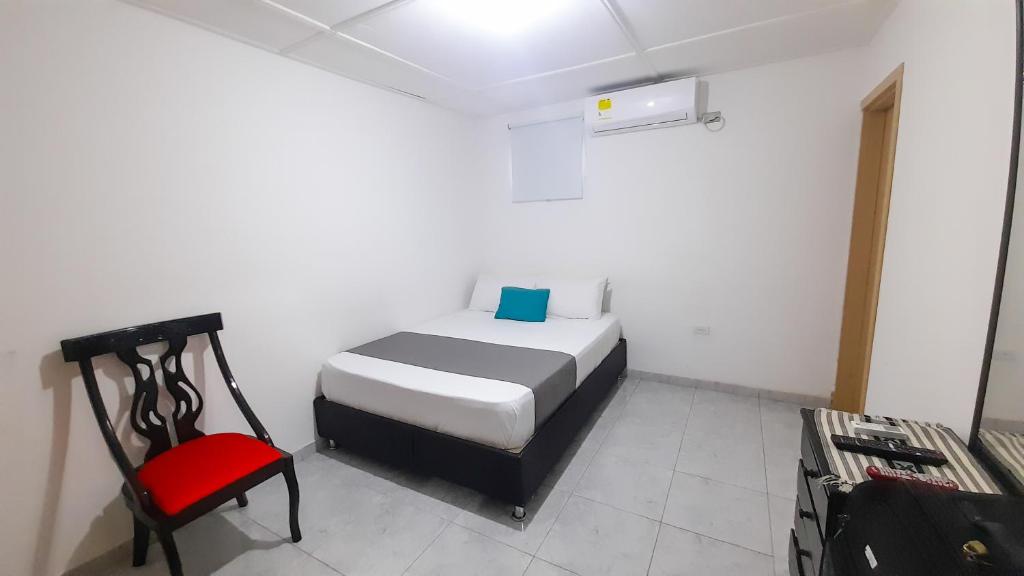Postel nebo postele na pokoji v ubytování Hotel Poblado Suite