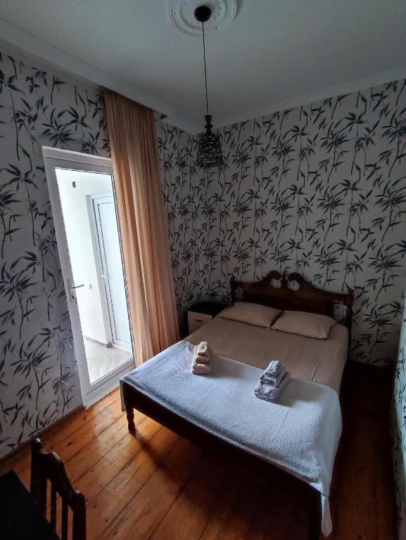 Postel nebo postele na pokoji v ubytování Kobuleti Guest House