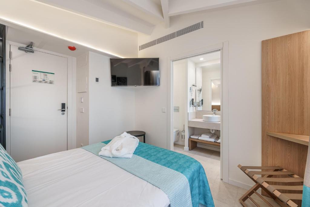 Postel nebo postele na pokoji v ubytování Can Guixe - Turismo de Interior
