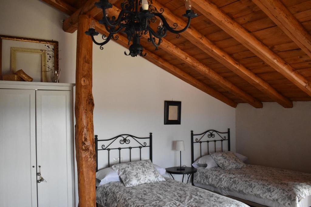 Postel nebo postele na pokoji v ubytování Tierras de Aguilera