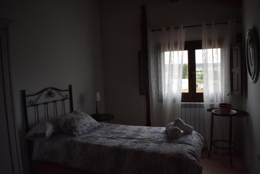 Postel nebo postele na pokoji v ubytování Tierras de Aguilera