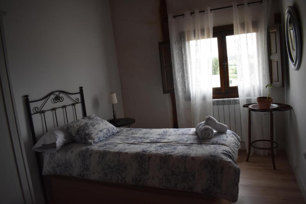 Postel nebo postele na pokoji v ubytování Tierras de Aguilera