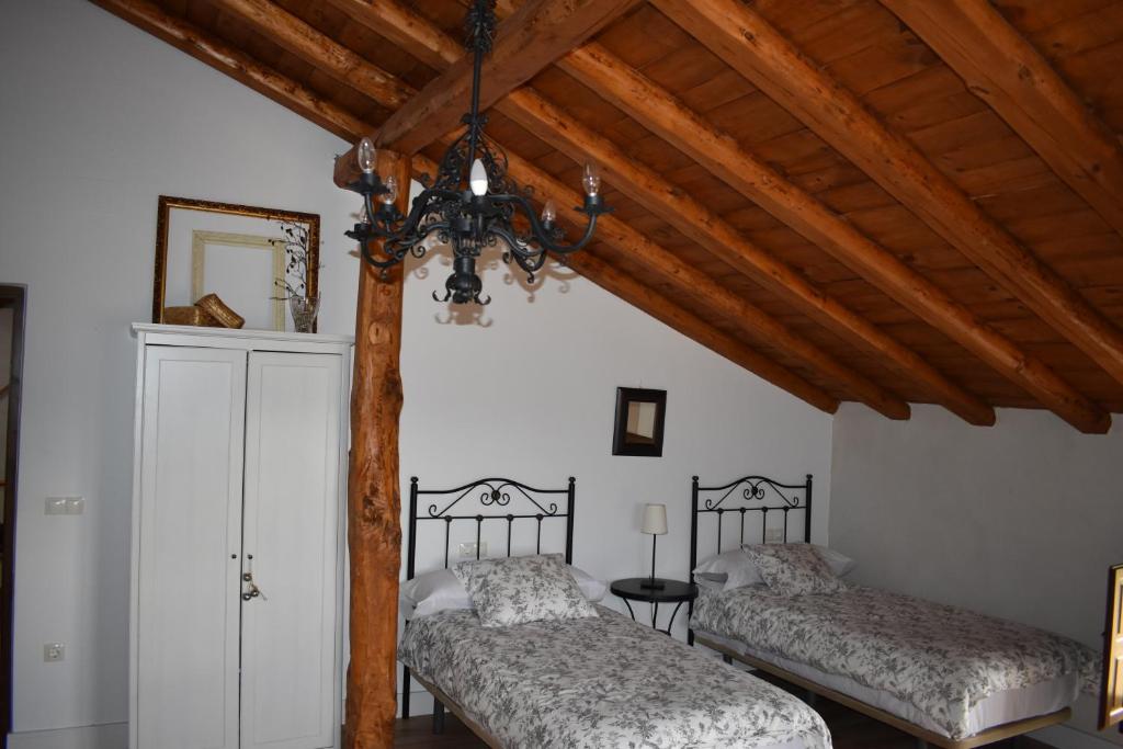 Postel nebo postele na pokoji v ubytování Tierras de Aguilera