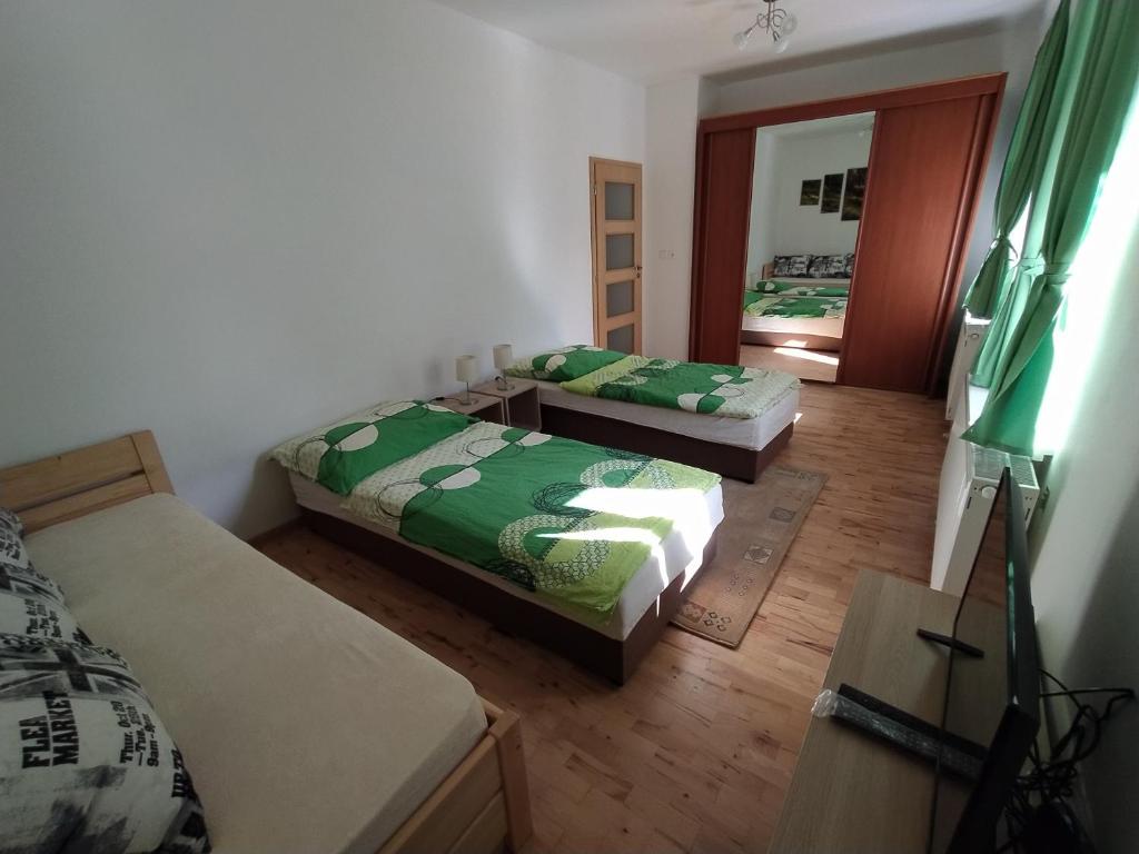 Postel nebo postele na pokoji v ubytování Apartmány LoNo