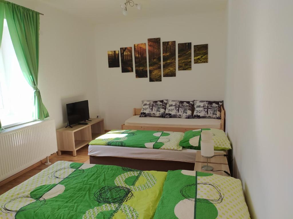 Postel nebo postele na pokoji v ubytování Apartmány LoNo