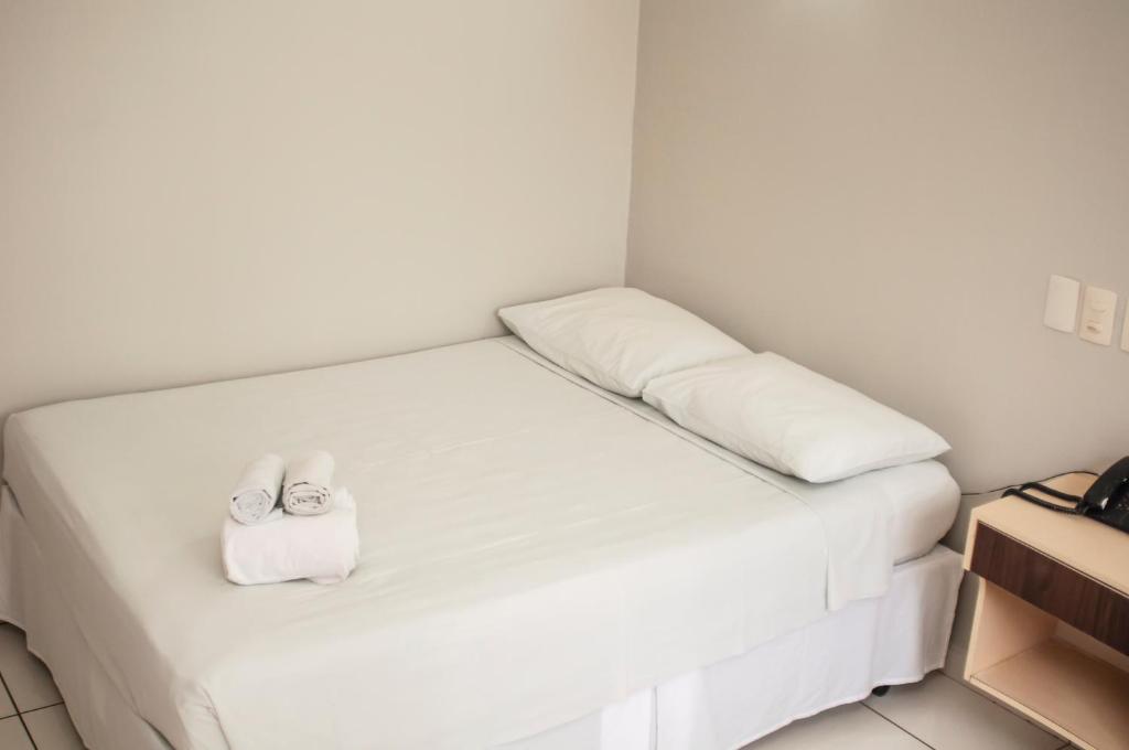 Postel nebo postele na pokoji v ubytování SMART IGUASSU HOTEL