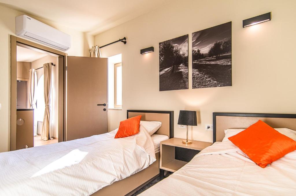 Postel nebo postele na pokoji v ubytování Villa Ulika by Villa Plus