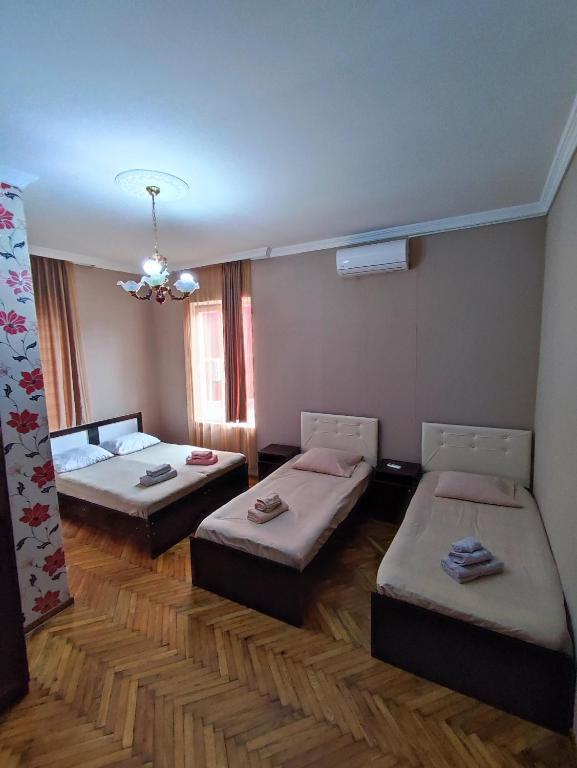 Postel nebo postele na pokoji v ubytování Kobuleti Guest House