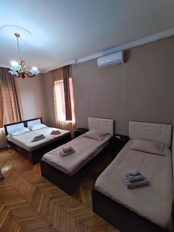 Postel nebo postele na pokoji v ubytování Kobuleti Guest House