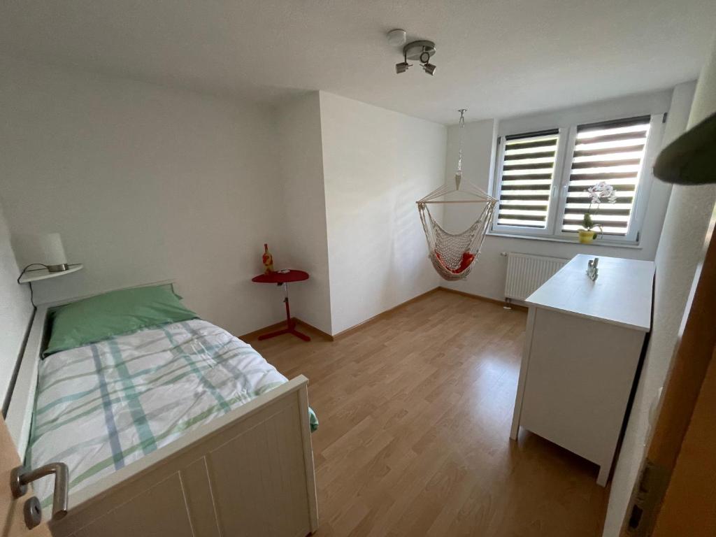 Postel nebo postele na pokoji v ubytování Ferienwohnung Dinkelberg