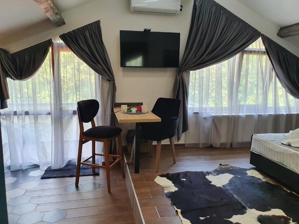 Postel nebo postele na pokoji v ubytování Kamelia guest rooms