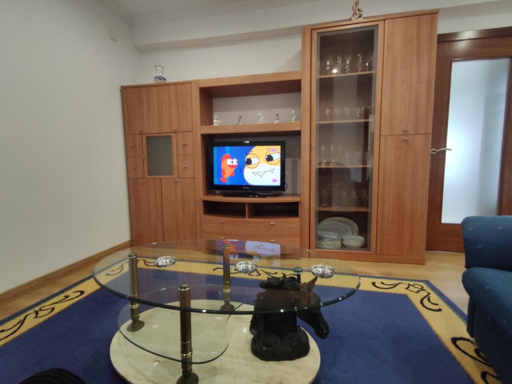 Televízia a/alebo spoločenská miestnosť v ubytovaní Casa Chouza