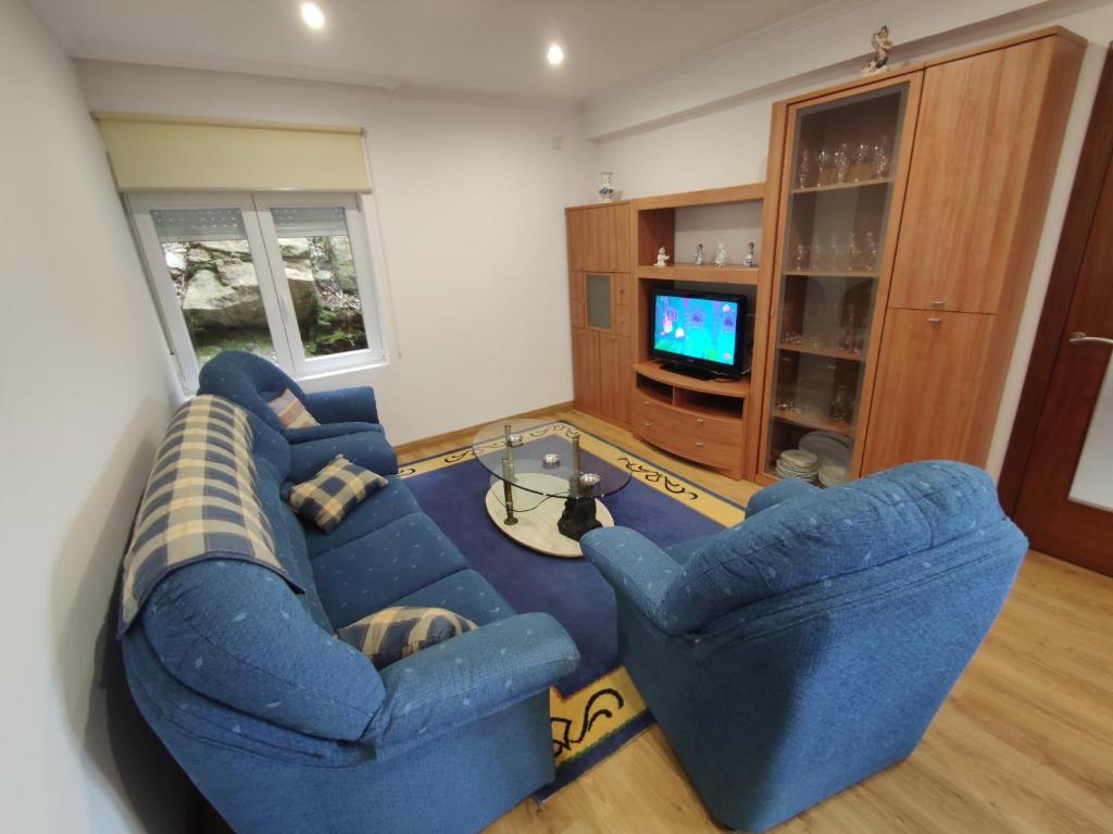 Televízia a/alebo spoločenská miestnosť v ubytovaní Casa Chouza