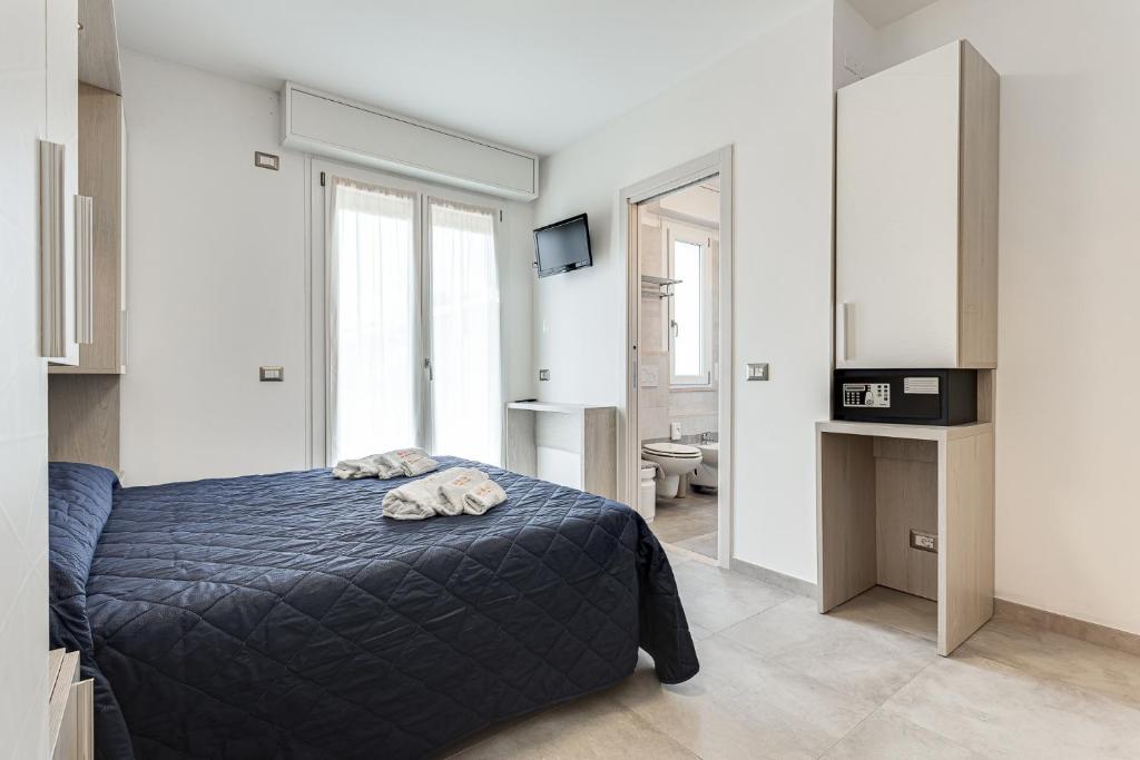 Postel nebo postele na pokoji v ubytování Hotel Riz