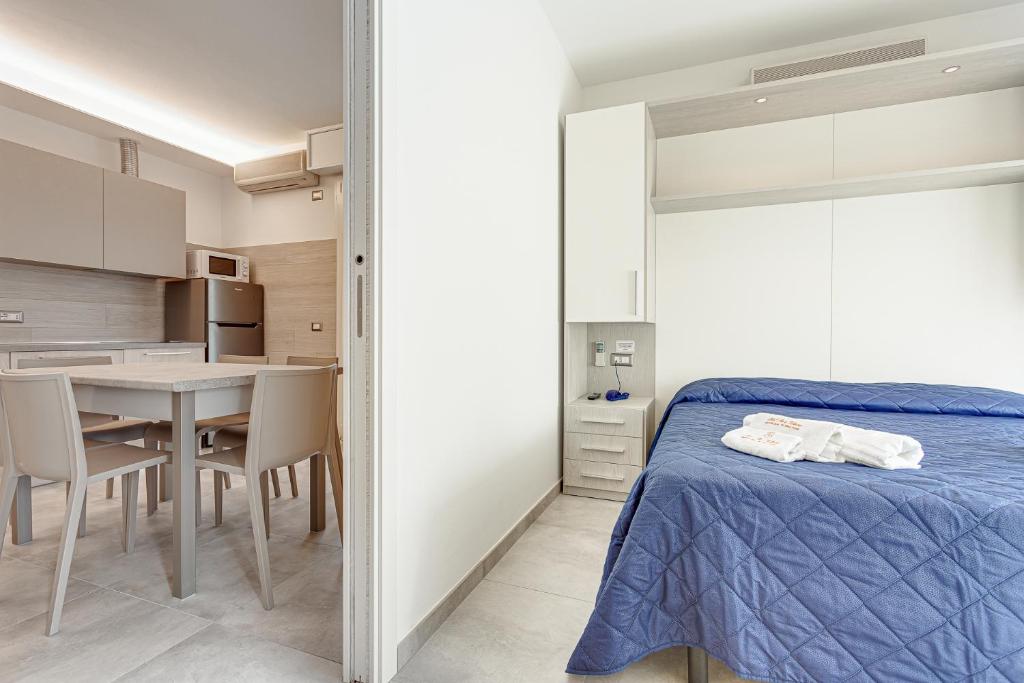 Postel nebo postele na pokoji v ubytování Hotel Riz