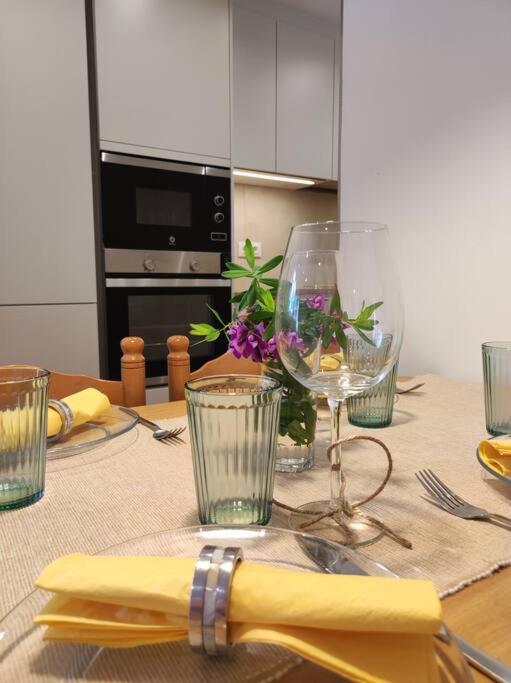 a table with glasses and a napkin on it at Apartament 'Es Botànic' in Blanes