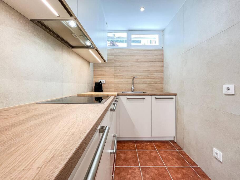 a kitchen with a sink and a counter top at Apartament 'Es Botànic' in Blanes