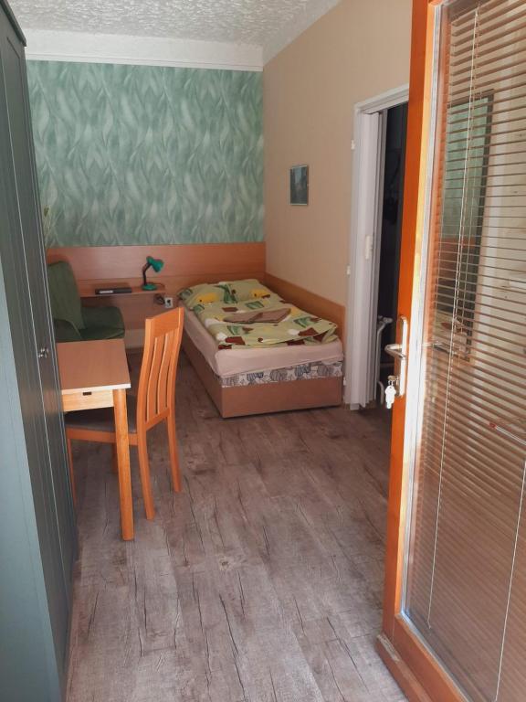 Postel nebo postele na pokoji v ubytování Apartmány Brno