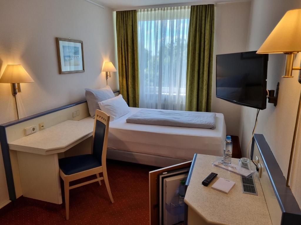 Postel nebo postele na pokoji v ubytování myMINGA13 - Hotel & serviced Apartments