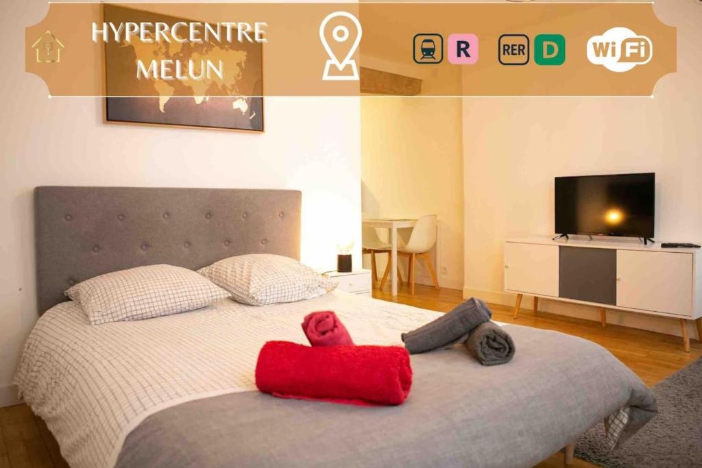 Voodi või voodid majutusasutuse Séjour à Melun Appart'Hôtel de l'Hypercentre toas