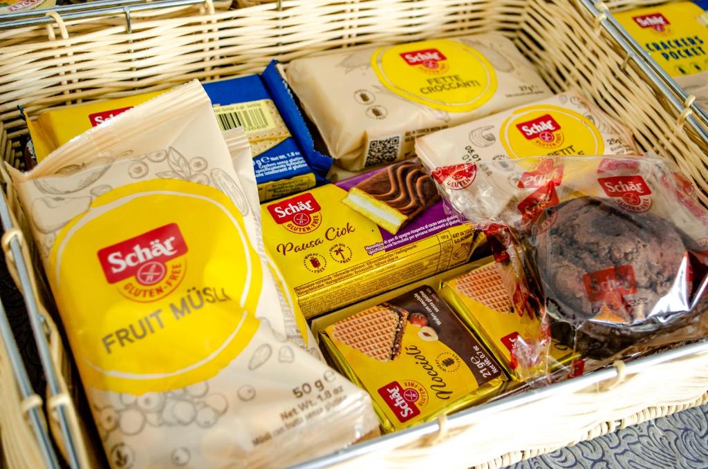 a shopping basket filled with different types of food at Hotel Regina del Mare in Ischia