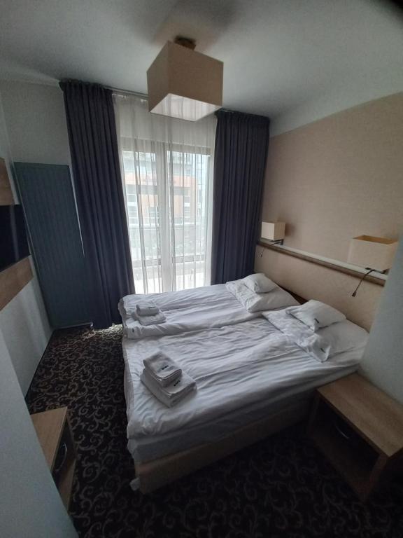 Postel nebo postele na pokoji v ubytování Ośrodek Warszawianka