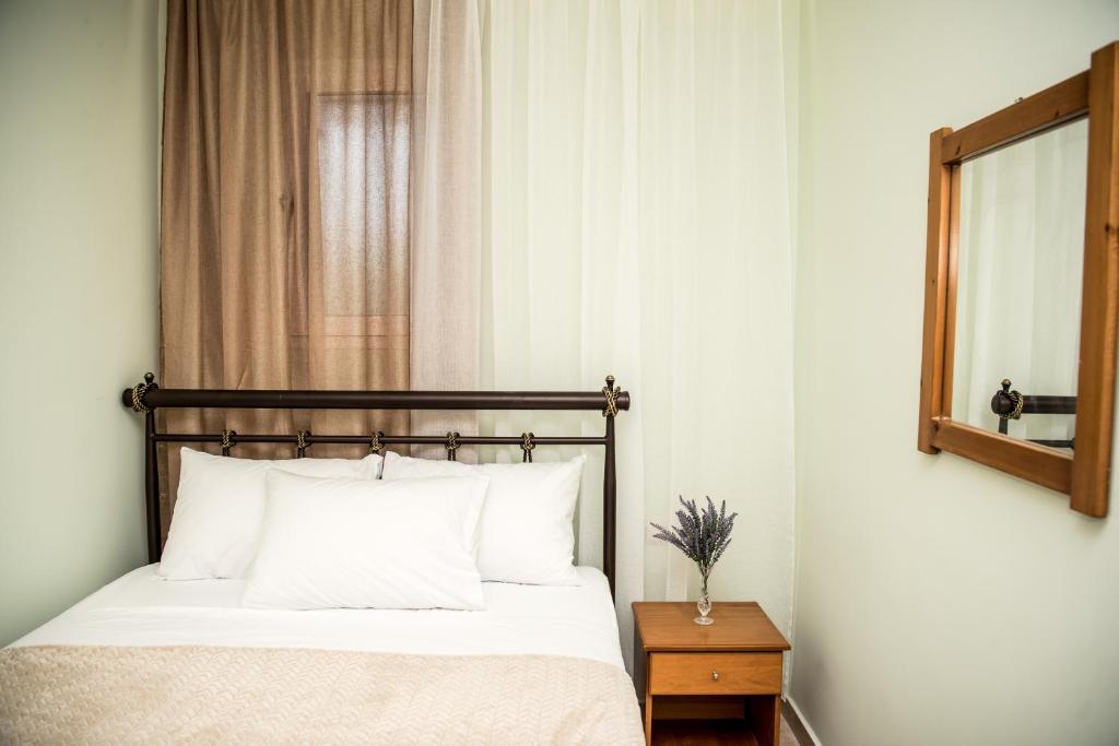 Postel nebo postele na pokoji v ubytování Avyssos Residents