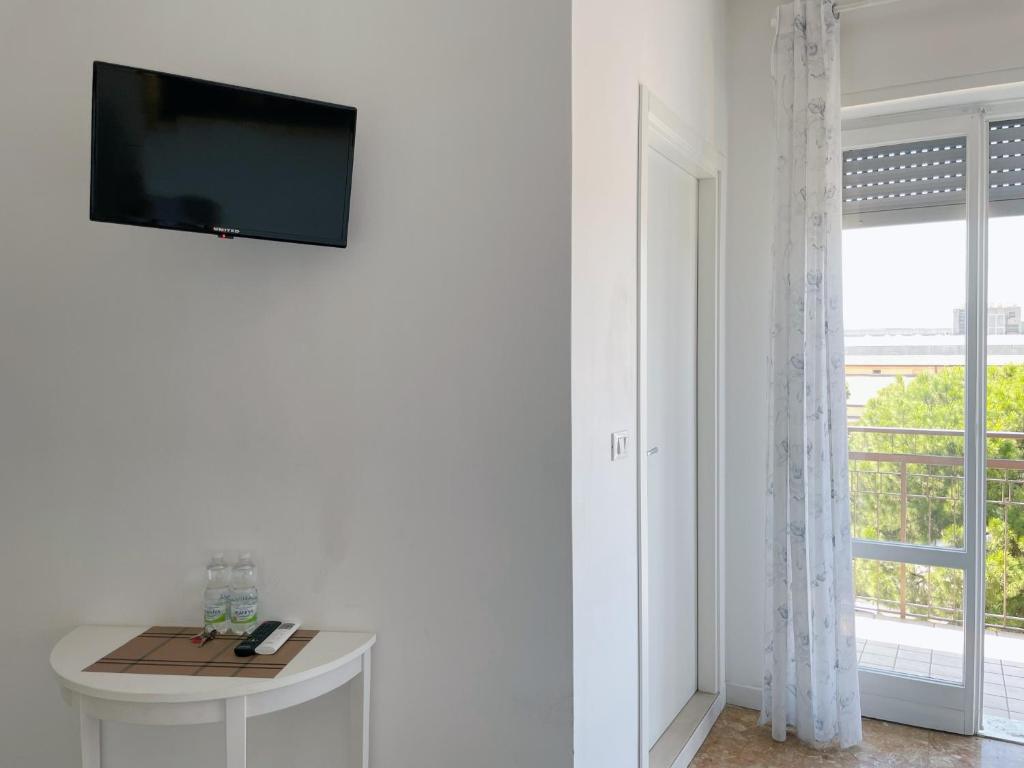 TV a/nebo společenská místnost v ubytování Confortini Rooms SUNDAY