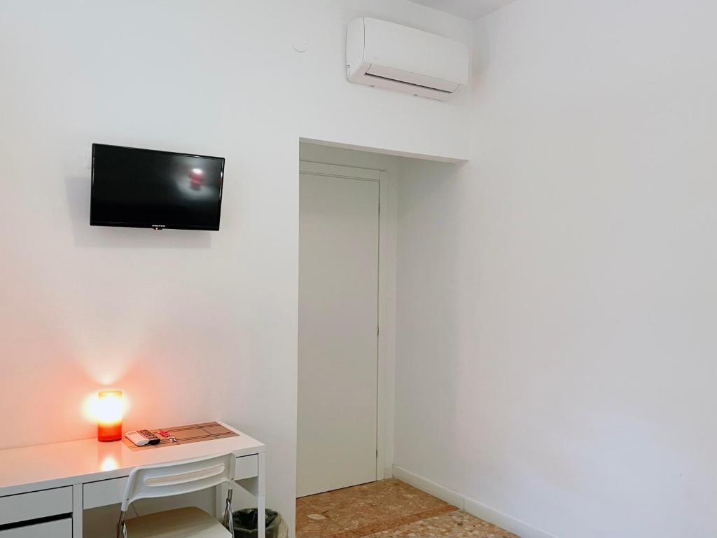 TV a/nebo společenská místnost v ubytování Confortini Rooms SUNDAY