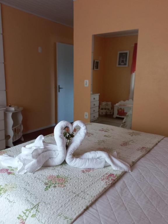 Postel nebo postele na pokoji v ubytování Aluguel de Temporada Tere Castilhos