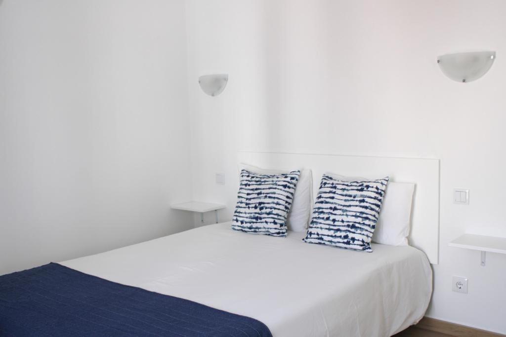 Кровать или кровати в номере Sudoeste Guest House