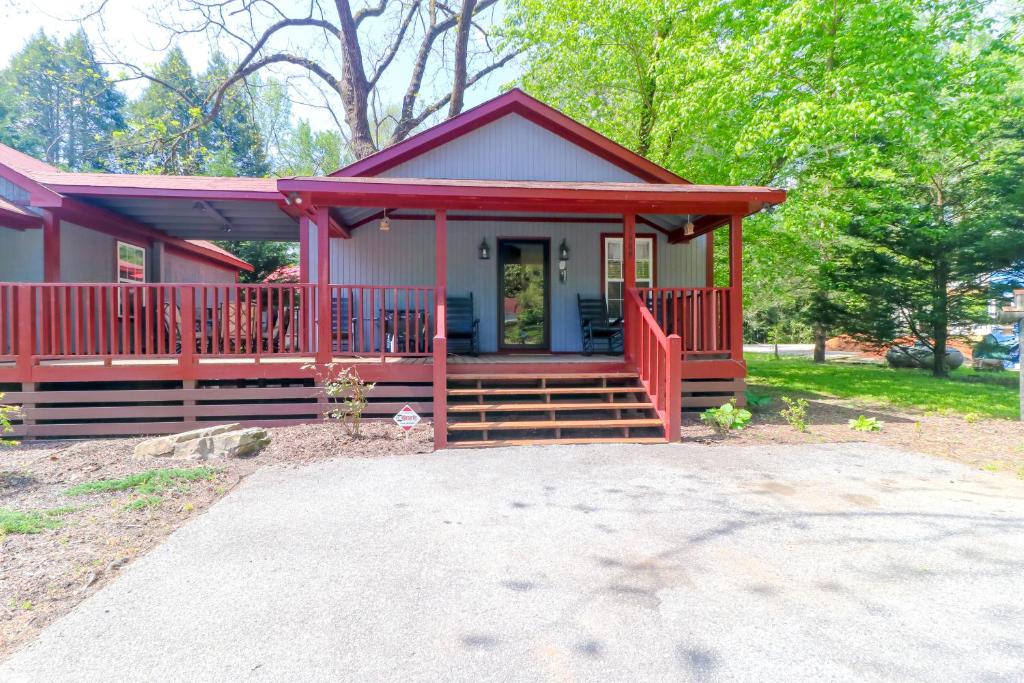 a small red house with a porch and stairs to it at Little Bear Retreat 1 in Helen