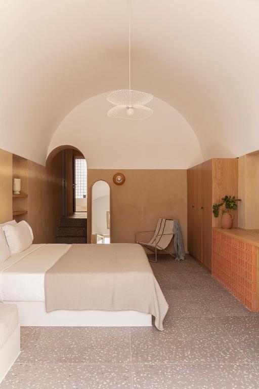 Postel nebo postele na pokoji v ubytování Ethos Vegan Suites