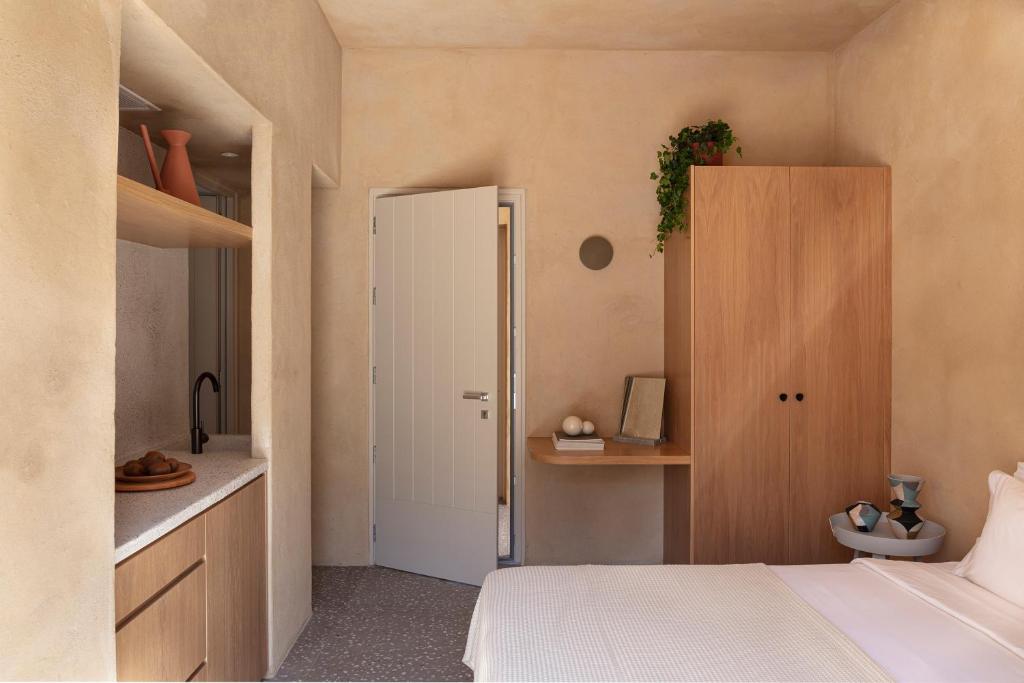 Postel nebo postele na pokoji v ubytování Ethos Vegan Suites