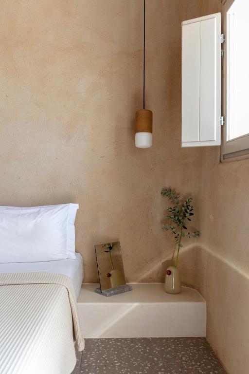 Postel nebo postele na pokoji v ubytování Ethos Vegan Suites