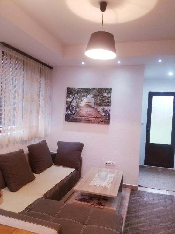 a living room with a couch and a table at Apartments Beka in Žabljak