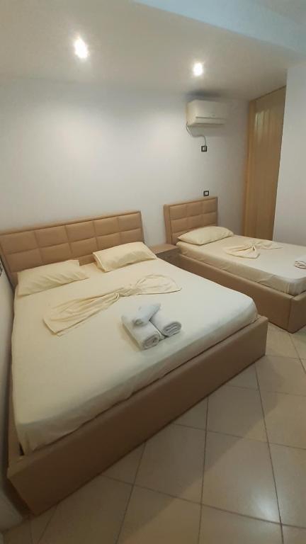 Postel nebo postele na pokoji v ubytování Hotel Vila Flowers