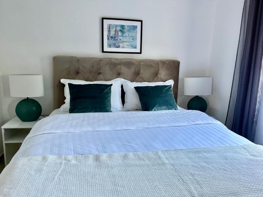 Łóżko lub łóżka w pokoju w obiekcie Apartments Fortuna