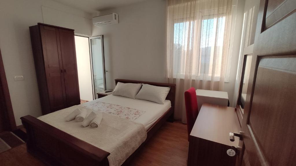 Postel nebo postele na pokoji v ubytování Robi Apartments