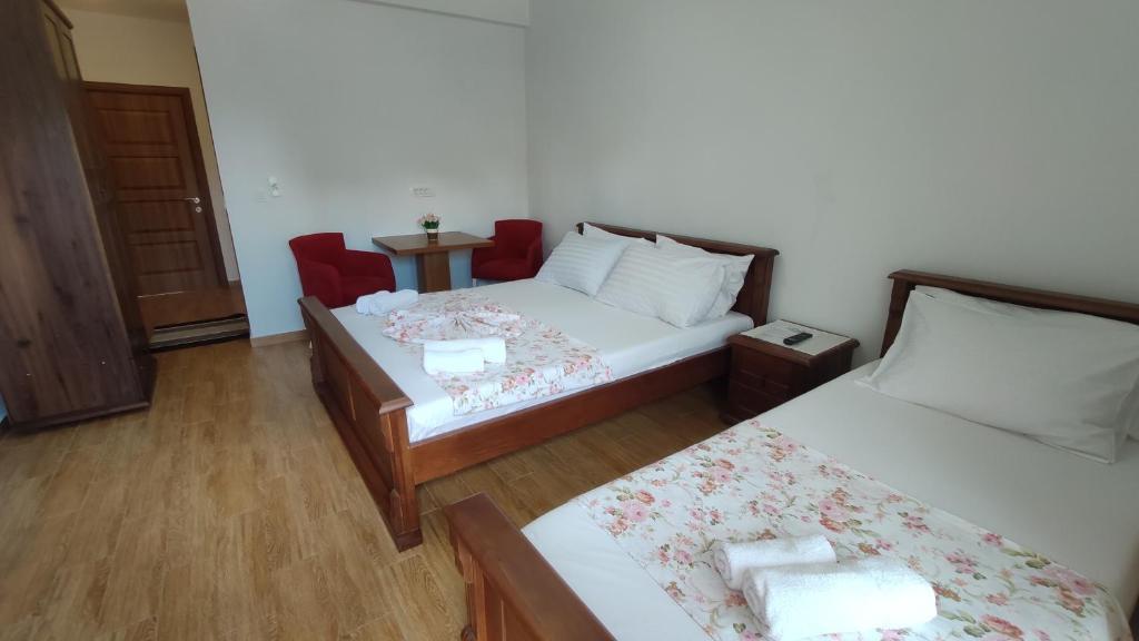 Postel nebo postele na pokoji v ubytování Robi Apartments