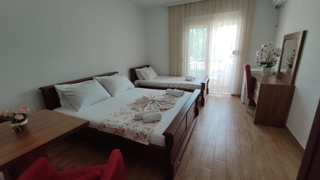 Postel nebo postele na pokoji v ubytování Robi Apartments