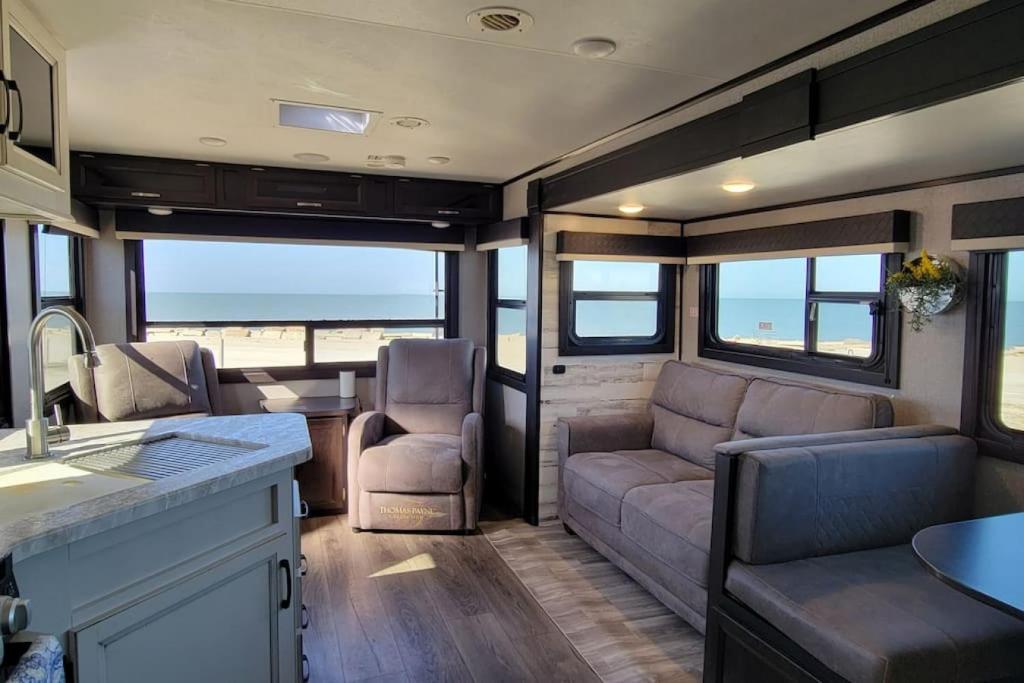 a rv living room with a couch and chairs at Brand New RV Bay Front in Port Lavaca