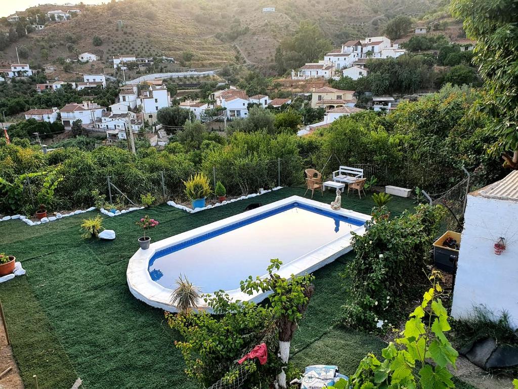 an image of a swimming pool in a yard at Casa Luis in Viñuela