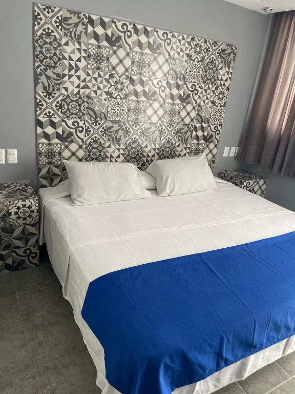 Postel nebo postele na pokoji v ubytování Hotel Rias